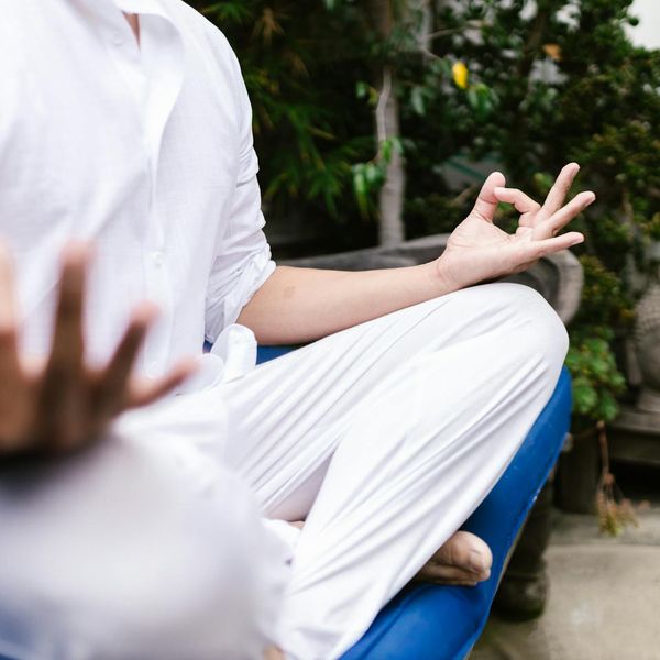 Person meditating in a serene setting, symbolizing inner peace and balance.
